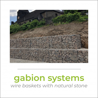 some gabions with an embankment above and a little church on top