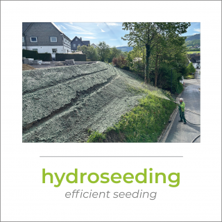Hydroseeding at a small slope with a house in the background